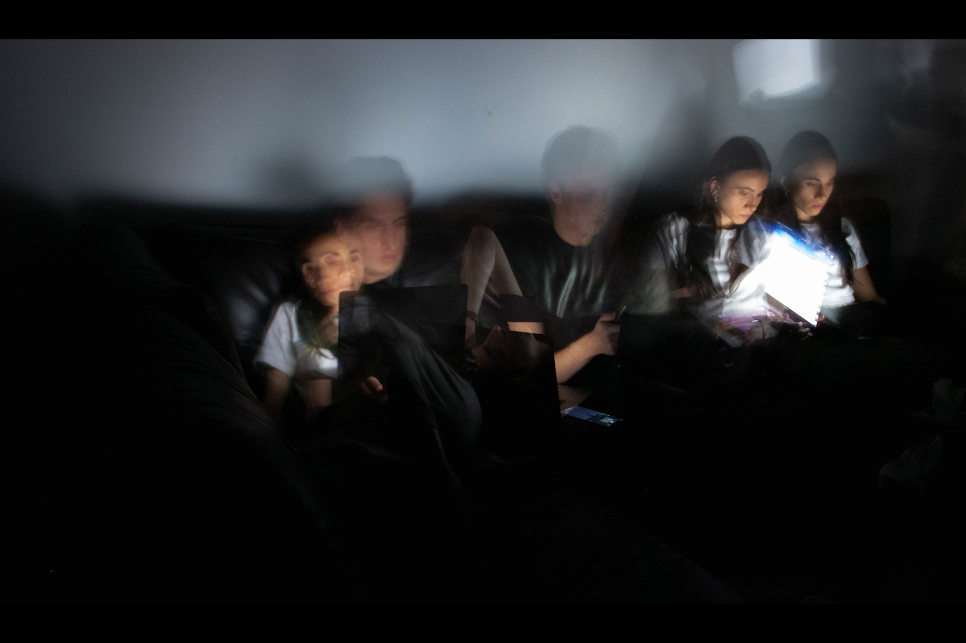 blurred images people on couch 